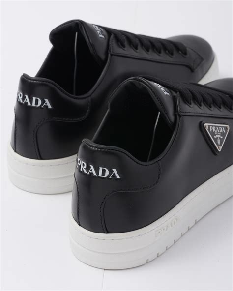 prada logo-embellished leather sneakers|Prada leather sneakers for men.